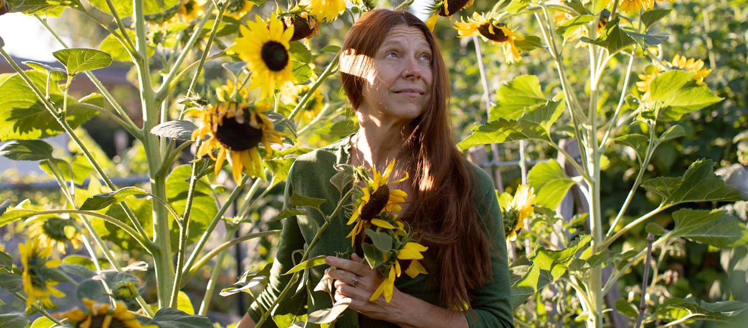 Tina Lilly in a sunflower garden